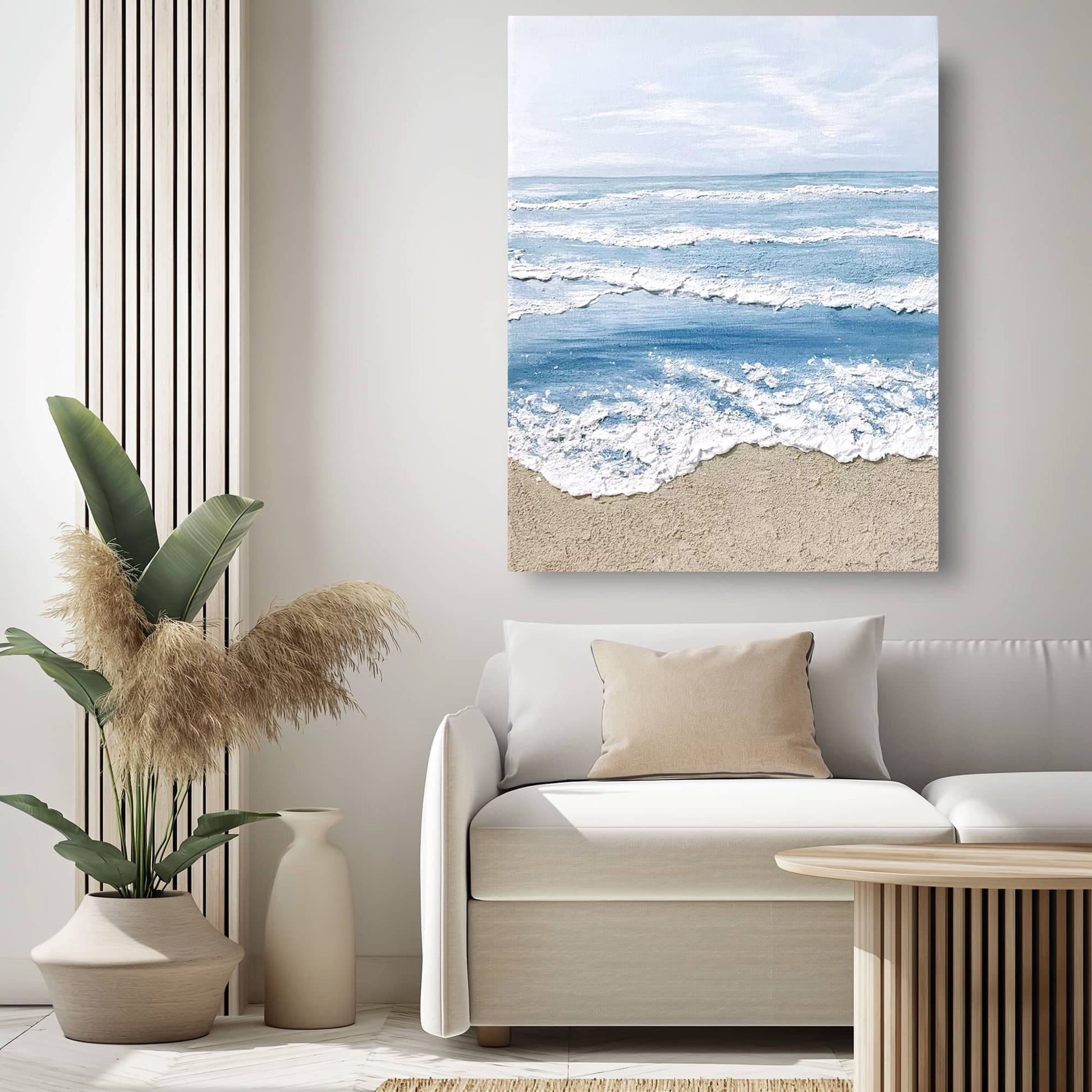 "Hand-painted, frameless textured wall art depicting the horizon at the edge of the sea. Titled 'AQUA HORIZONS,' this portrait-shaped artwork features a colour palette of blue, cream, and white, hanging in the living room."