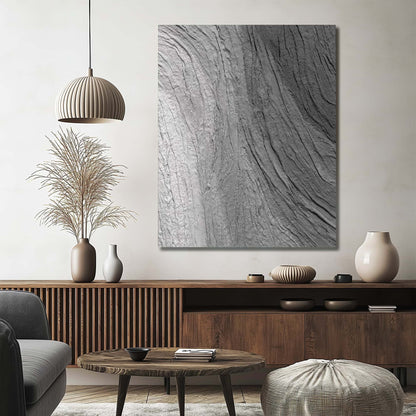 "Hand-painted, abstract textured wall art with a three-dimensional and linear design. Titled 'BLACK ICEBURG,' this artwork can be hung in both portrait orientation, featuring a colour palette of black, grey, and white, hanging in the hallway."