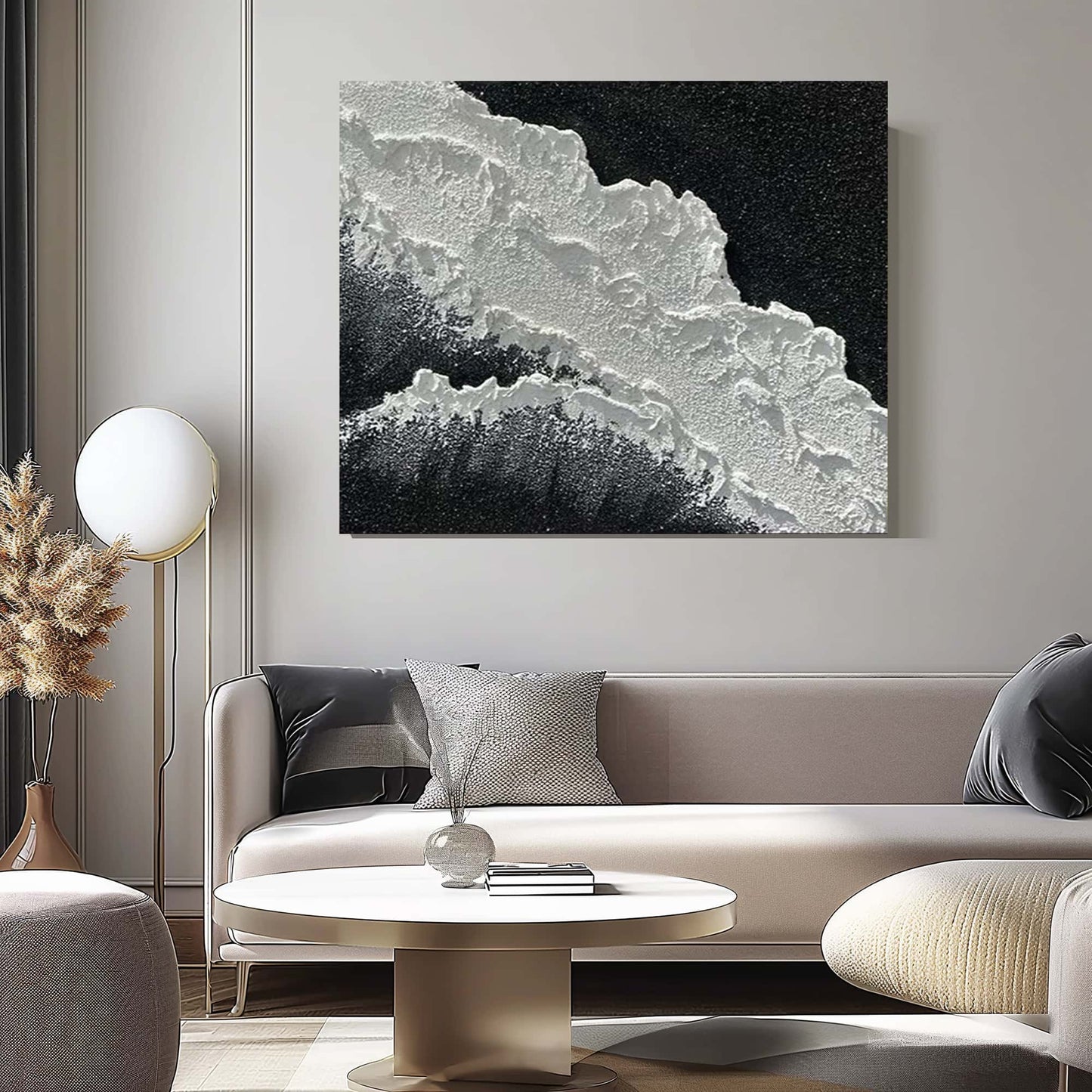 "BLACK BEACH, STYLE A: Hand-painted Landscape shaped textured wall art painting depicting a black beach with crashing waves, hanging in the living room, in shades of black, white, and grey."