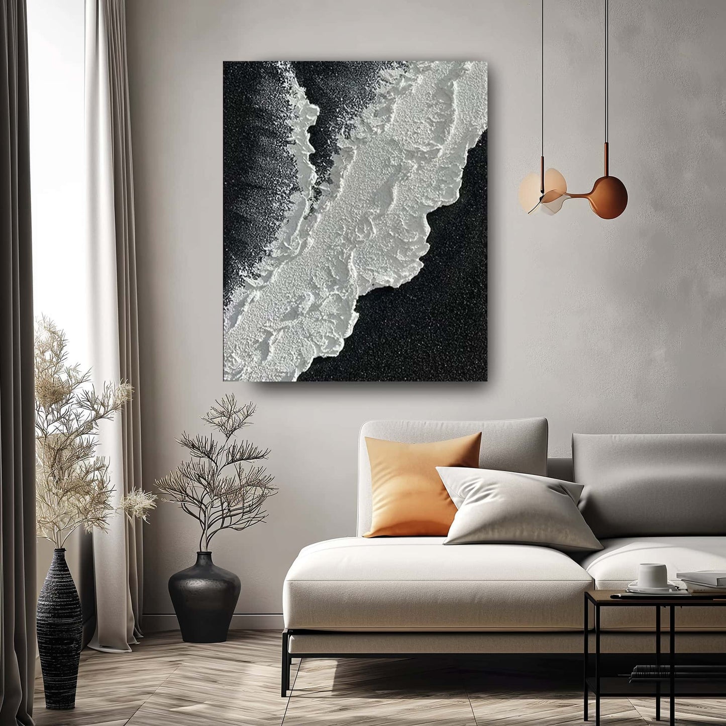 "BLACK BEACH, STYLE A: Hand-painted Portrait shaped textured wall art painting depicting a black beach with crashing waves, hanging in the lounge, in shades of black, white, and grey."