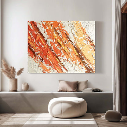 "Hand-painted Landscape shaped abstract textured wall art named 'Flames Dance.' The artwork features a white background with vibrant and dynamic colors, including yellow, orange, and red. The lively colors evoke a warm and energetic feeling. Displayed in the hallway."