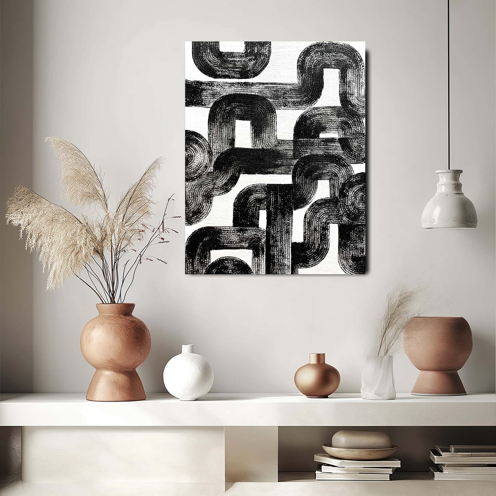 "Hand-painted Portrait shaped abstract textured wall art named 'Maze Melody.' The artwork features a white background with black, pipe-like textures that appear chaotic yet structured, intertwining like a maze. Hanging in hallway."