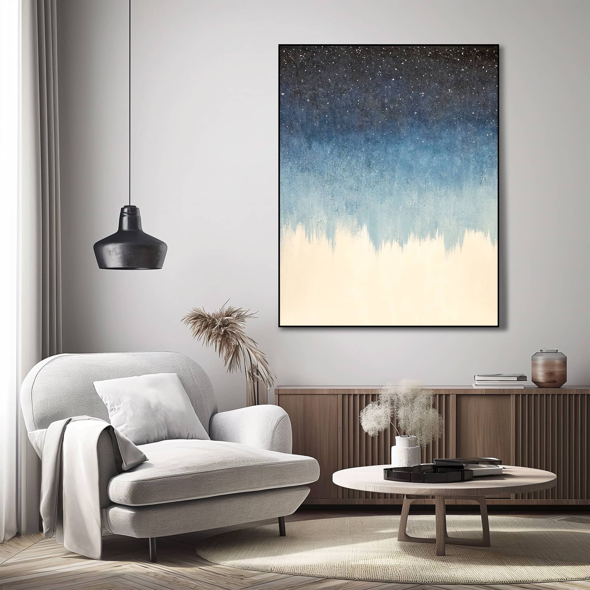 "Hand-painted, frameless abstract textured wall art depicting a starry night sky. Titled 'STARFIELD,' this portrait-shaped artwork features a colour palette of navy blue and white, hanging in the lounge."