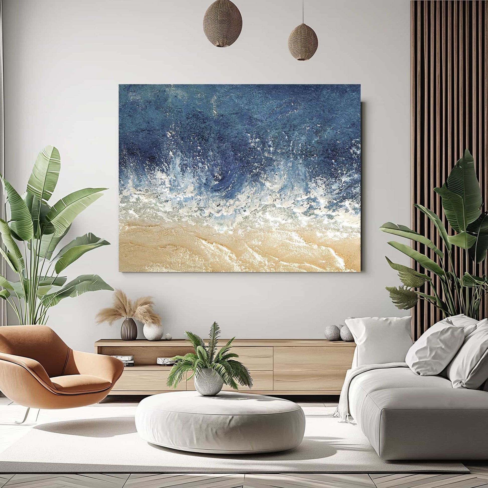 "Hand-painted, textured wall art depicting waves and sandy shores. Titled 'THE SEASHORE, STYLE C,' this landscape-shaped artwork in shades of blue and cream is elegantly hung in the living room."