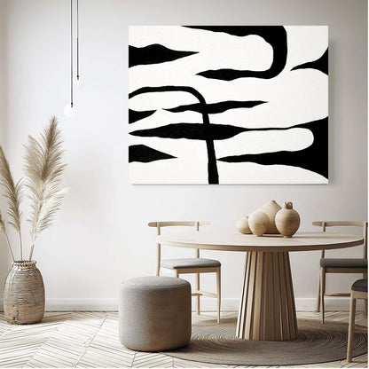 "LIGHT AND SHADOW: Hand-painted. Landscape shaped abstract textured wall art painting in white and black colours, hanging on the wall in the dining room."