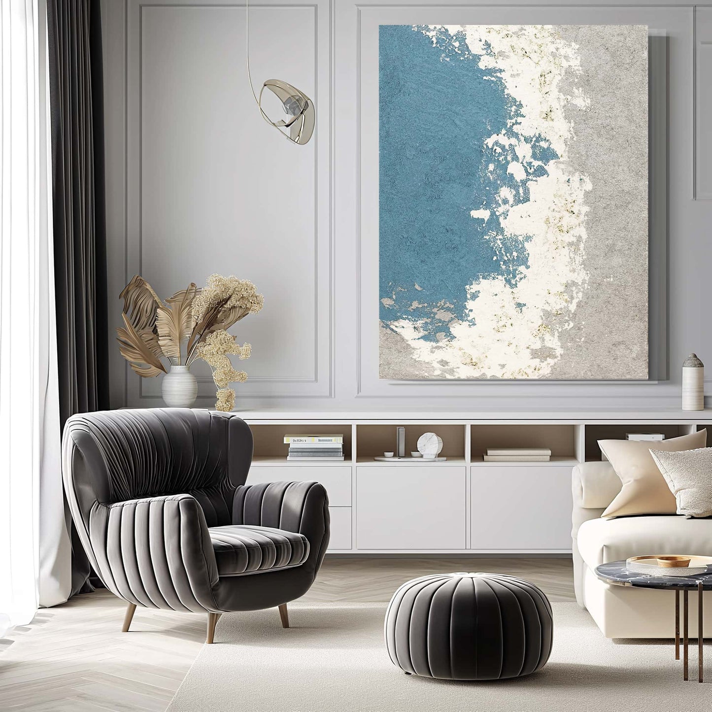 "SILVER BAY: Hand-painted Portrait shaped abstract textured wall art painting depicting an abstract bay, full of texture, in shades of blue, white, grey, and gold, hanging on the wall in the living room."