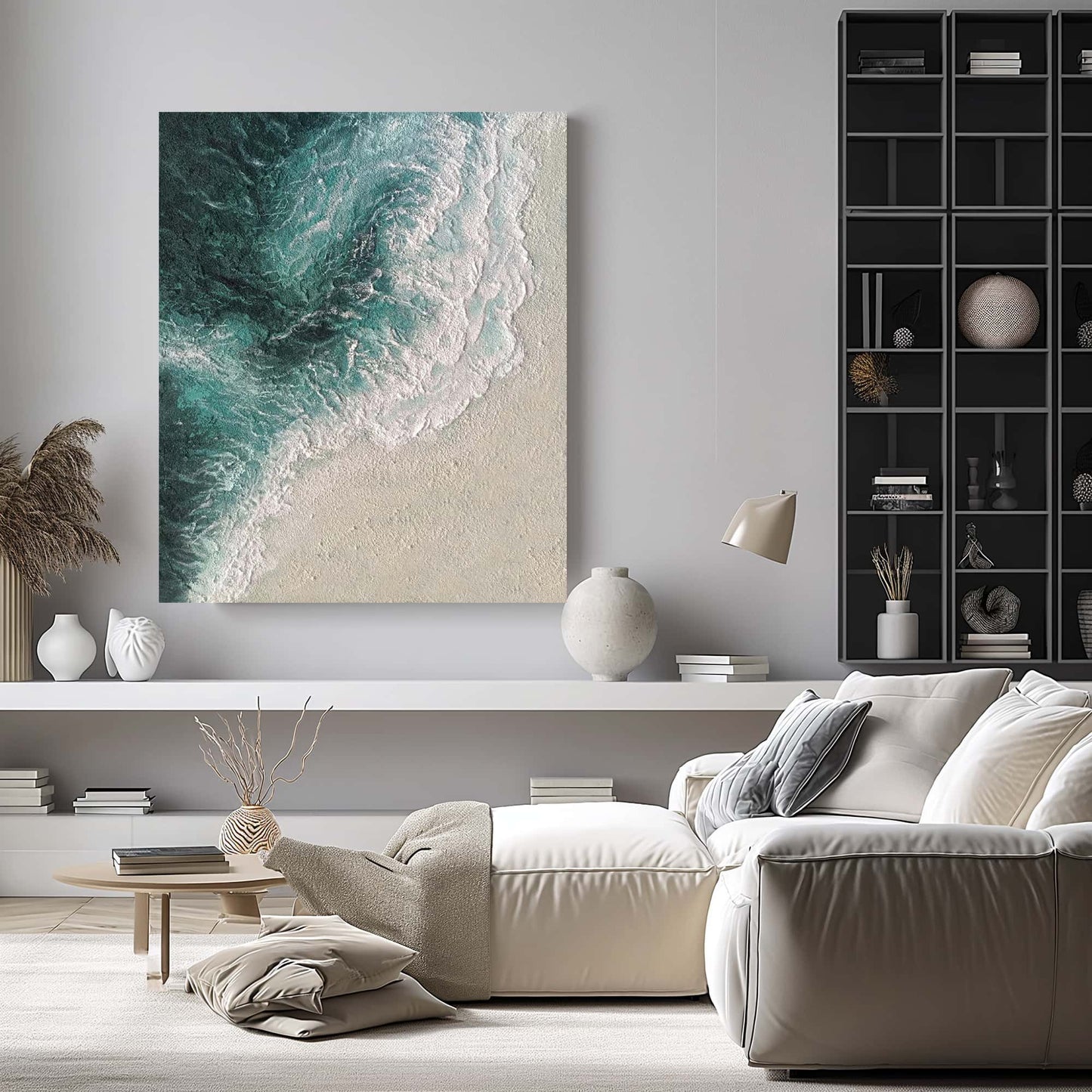 "THE SEASHORE, STYLE A: Hand-painted Portrait shaped textured wall art painting depicting a textured seascape with azure sea, white waves crashing on cream-colored shores, and a rich blend of colors including sand, grey, blue, green, white, cream and sapphire, hanging on the wall in the living room."